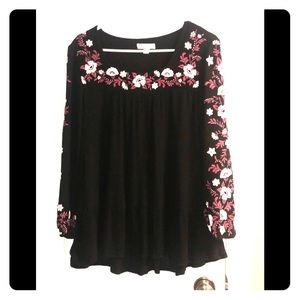 Black top with pink and white floral detail